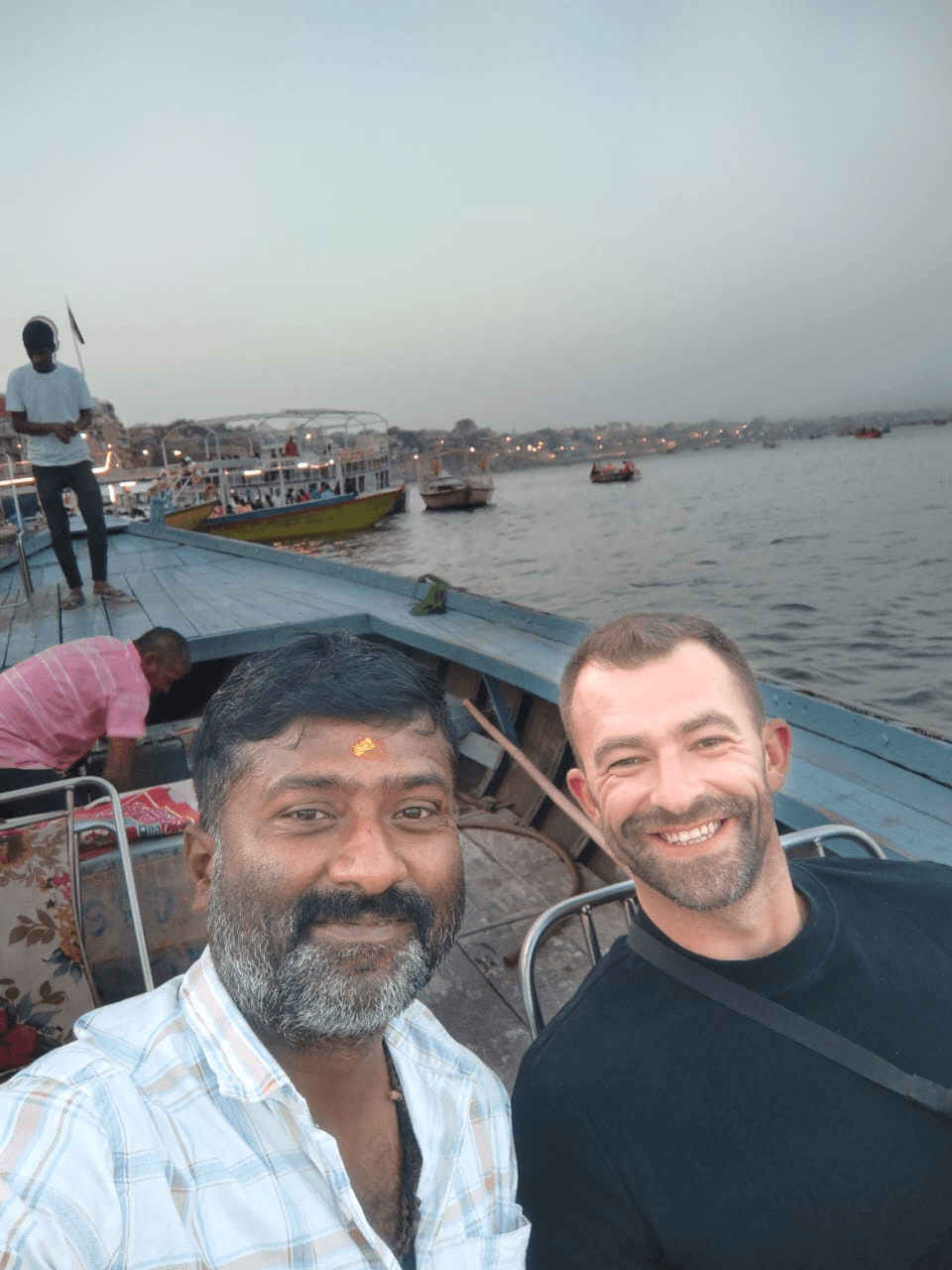 Travelers on a boat in the Ganges river