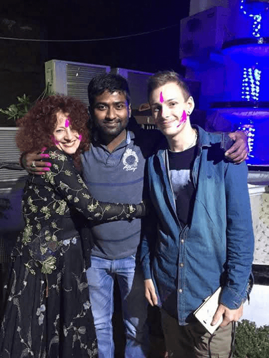 Friends celebrating with Holi colors